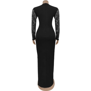 Detailed back view of a slim black maxi dress with sparkling rhinestone sleeves