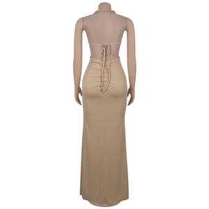 Detail view of khaki halter dress featuring open back design and ruched drawstring texture