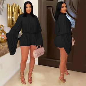 Elegant black pleated romper with high neck and wide flared sleeves for parties