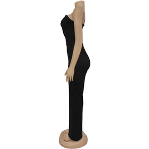 Side view of chic black slim-fit sleeveless jumpsuit with elegant gold button details
