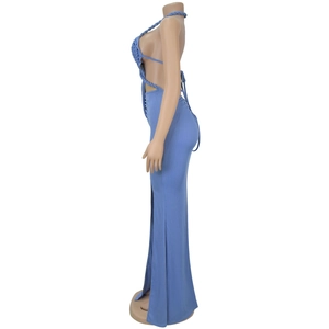 Detail view of light blue knitted dress with side cutout and high slit design