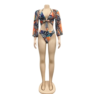 Three-piece bikini set featuring abstract art print with a long sleeve sheer cover-up
