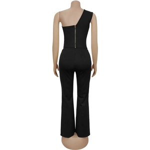Detail view of women's black two-piece set featuring back zipper on a one-shoulder top