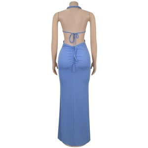 Detail of light blue ribbed knit fabric and back ruching on halter neck maxi dress