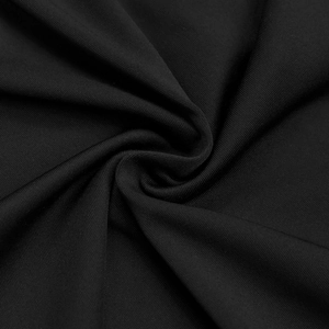 Macro shot of high-quality black pleated knit fabric texture and soft drape detail