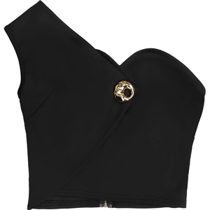 Detail of black one-shoulder crop top with asymmetrical cut and golden buckle accent