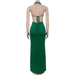 Close-up of ruched back detail and halter neck ties on emerald green knit maxi dress