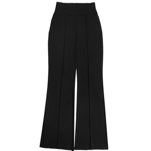 Detail of black high-waisted flare trousers with pin-tuck seam and elegant drape fabric