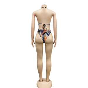 Rear view of sexy halter neck bikini with abstract geometric print and high cut bottoms
