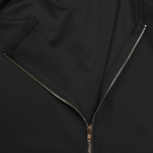 Detailed macro view of black woven fabric texture and premium bronze metal zipper