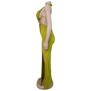 Detail of olive green knit dress with side cut-out and high slit on a mannequin