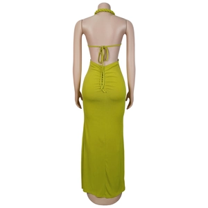 Detail of avocado green halter dress featuring ribbed knit texture and open back tie design
