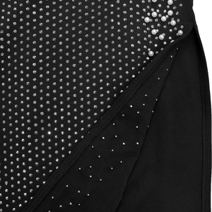 Detail of high side slit on black dress featuring silver rhinestones and white pearls