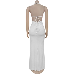 Detail of white halter neck maxi dress with backless design and vertical rib texture