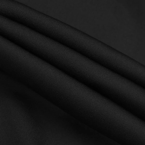 Detailed close-up of premium black twill fabric texture for elegant sleeveless suit sets