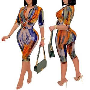 Women's two-piece fashion set with V-neck abstract print shirt and slim-fit capri pants