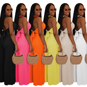 Vertical rib-knit two-piece set featuring halter neck crop top and high-waist pants