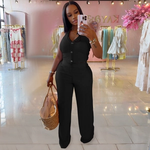Detail of black ribbed fabric on halter neck button vest and wide leg pants set