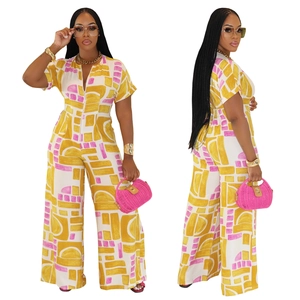 Women's yellow and pink geometric print wide-leg jumpsuit with short sleeves and belted waist
