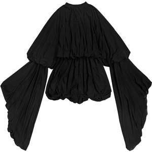 Close-up detail of pleated texture on a black long-sleeve avant-garde designer top