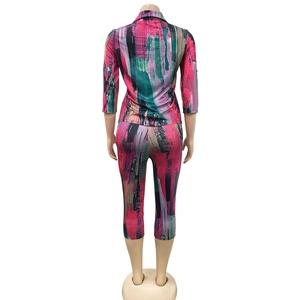 Rear view of women's two-piece set with vibrant abstract oil painting print on mannequin