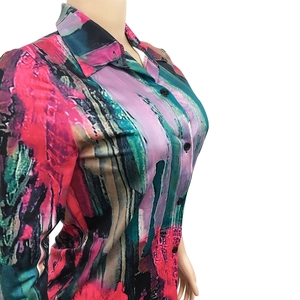 Detail of colorful abstract oil painting print on women's V-neck satin shirt