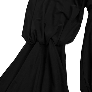 Detail of black pleated fabric showing semi-transparent mesh stitching and twisted knot texture