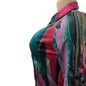 Detail view of women's long sleeve blouse with vibrant abstract oil painting print
