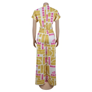 Detailed back view of casual short sleeve jumpsuit with yellow and pink geometric print