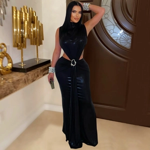 Detail of elegant black turtleneck maxi dress featuring side cutouts and silver metal ring