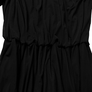 Close-up of pleated black mesh fabric showing elastic waist detail and fine grid texture