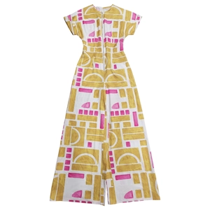 Detail of white wide-leg jumpsuit featuring colorful geometric print and front zipper closure