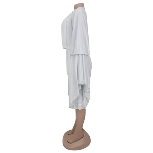 Detail view of the layered pleated design on the white sleeveless casual women's romper