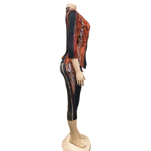 Detailed side view of women's two-piece casual set featuring abstract print and V-neck top