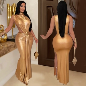 Detail of elegant gold metallic high-neck dress with waist cut-out and high slit
