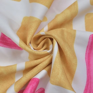 Close-up of lightweight fabric showing vibrant yellow and pink brushstroke print texture
