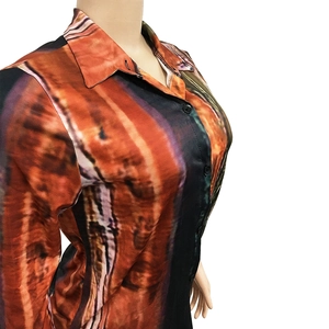 Detail of multi-color abstract print fabric on a slim-fit button-down long sleeve shirt