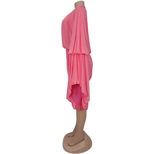 Detail of pink fashion romper featuring dramatic layered ruffle sleeves and pleated texture