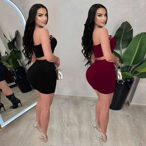 Women's 2-piece bodycon set with halter crop top and mini skirt in black and burgundy