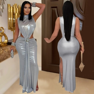 Detail view of silver metallic dress featuring high neck, side cut-out, and ruched slit hem