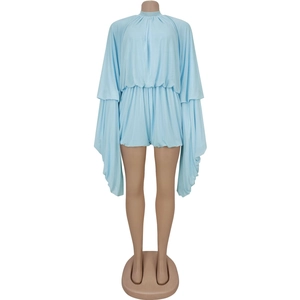 Detail of light blue two-piece set featuring pleated cape sleeves and matching shorts