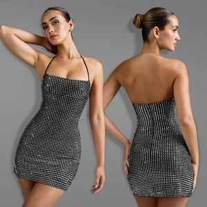 Detail view showing black halter dress with sparkling silver rhinestones and open back design
