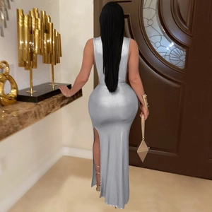 Detail view of silver grey metallic backless maxi dress with a sexy high side slit