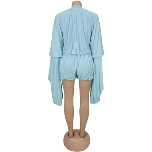 Detailed back view of a light blue pleated romper featuring long draped sleeves and hidden zipper