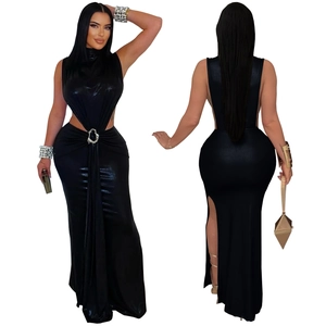 Detail of high neck black gown featuring side waist cutouts and silver metal buckle accent