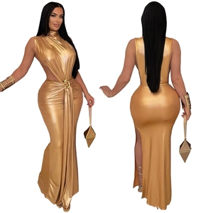 Detail of gold metallic dress featuring side cut-outs and ring waist decoration