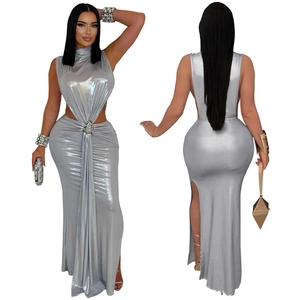 Detail of silver metallic dress with waist cutout, metal ring, and side slit design