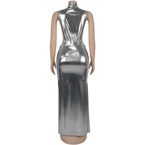 Silver metallic dress detail showing high-neck halter design and reflective backless texture
