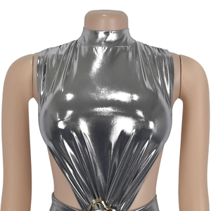 Detail of silver metallic turtleneck bodysuit with side cut-outs and golden metal rings