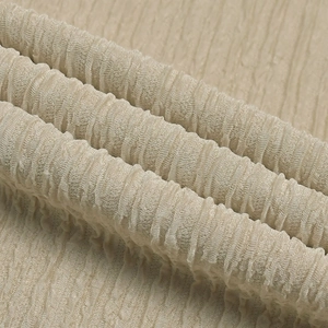 Detailed macro shot of beige pleated fabric texture for women's casual set outfit
